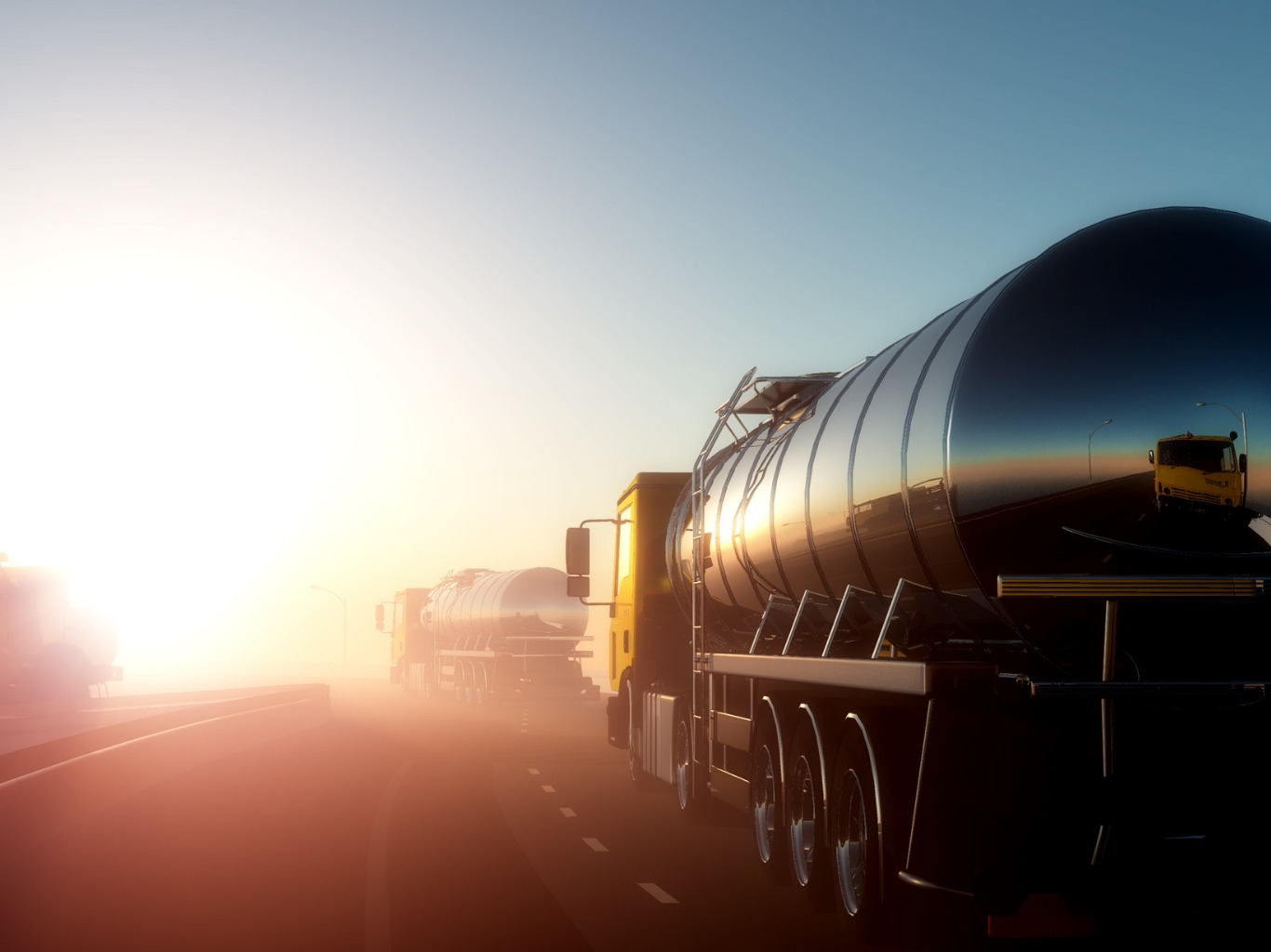 Fleet of fuel tanker trucks at depot